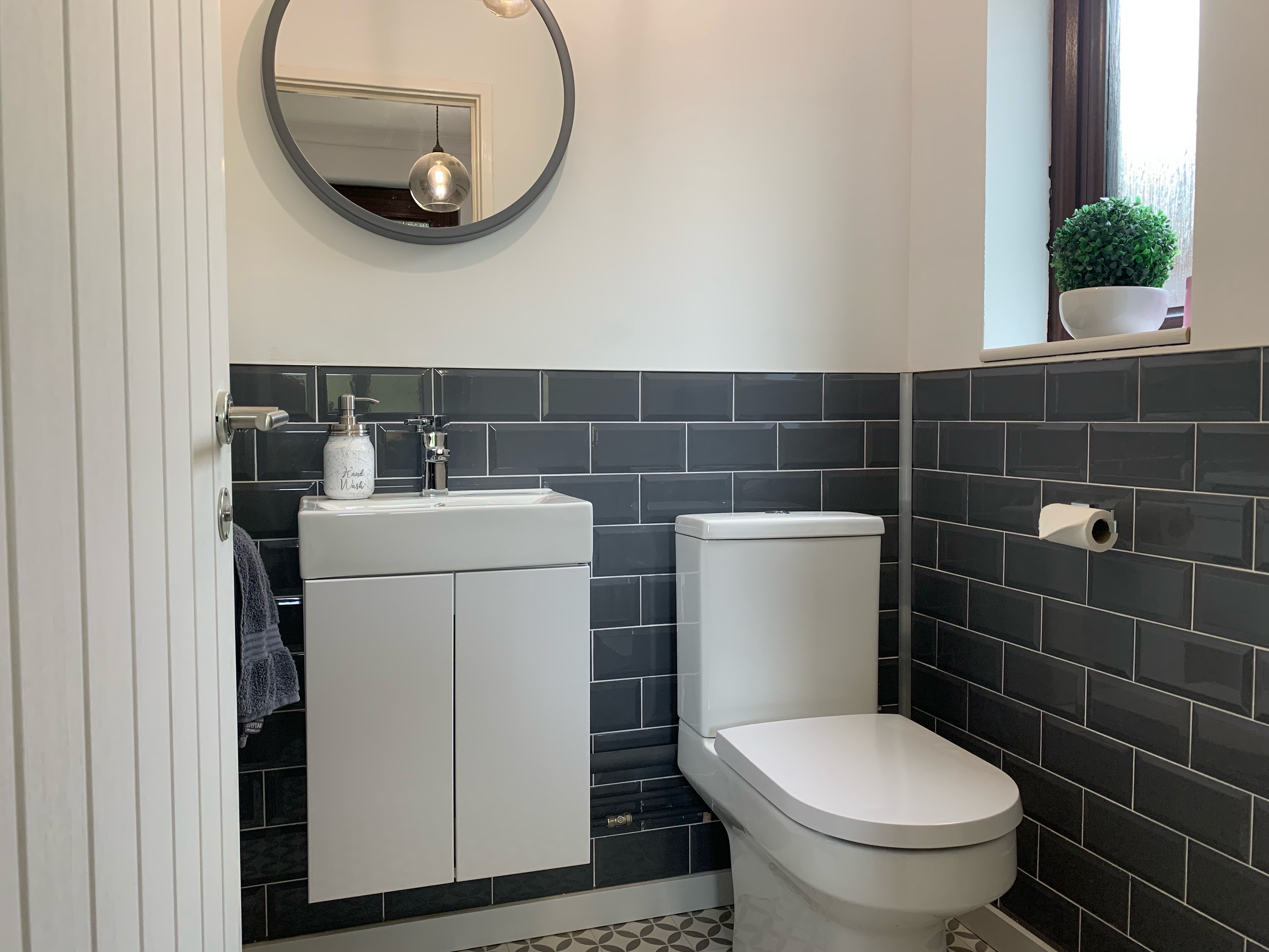 Cloakroom refit with grey metro tiles and mosaic vinyl floor